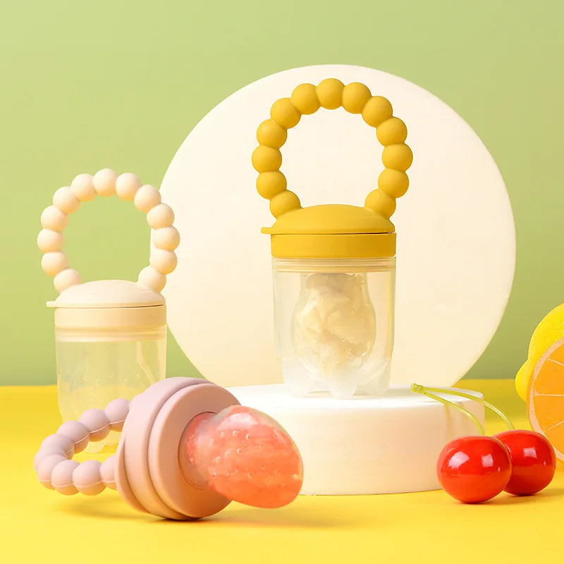 Baby Fruit Feeder Pacifier with Silicone Mesh in beige, Yellow, and Pink